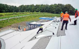 Protection mat and shear removal drainage element are installed, space is kept free for the solar panels. Protection mat and shear removal drainage element are installed